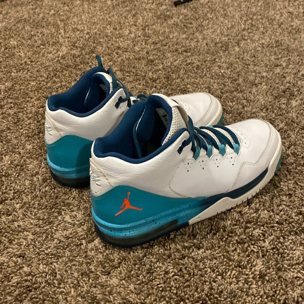 Teal and white Jordan’s